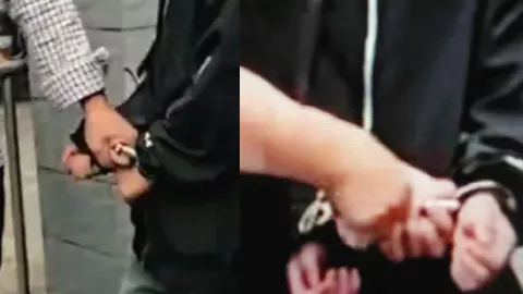 男孩被铐